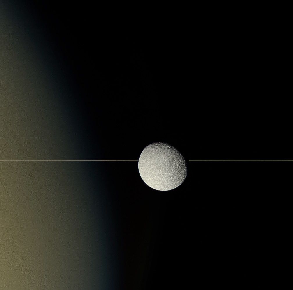 Dione and Saturn's rings seen edge on
