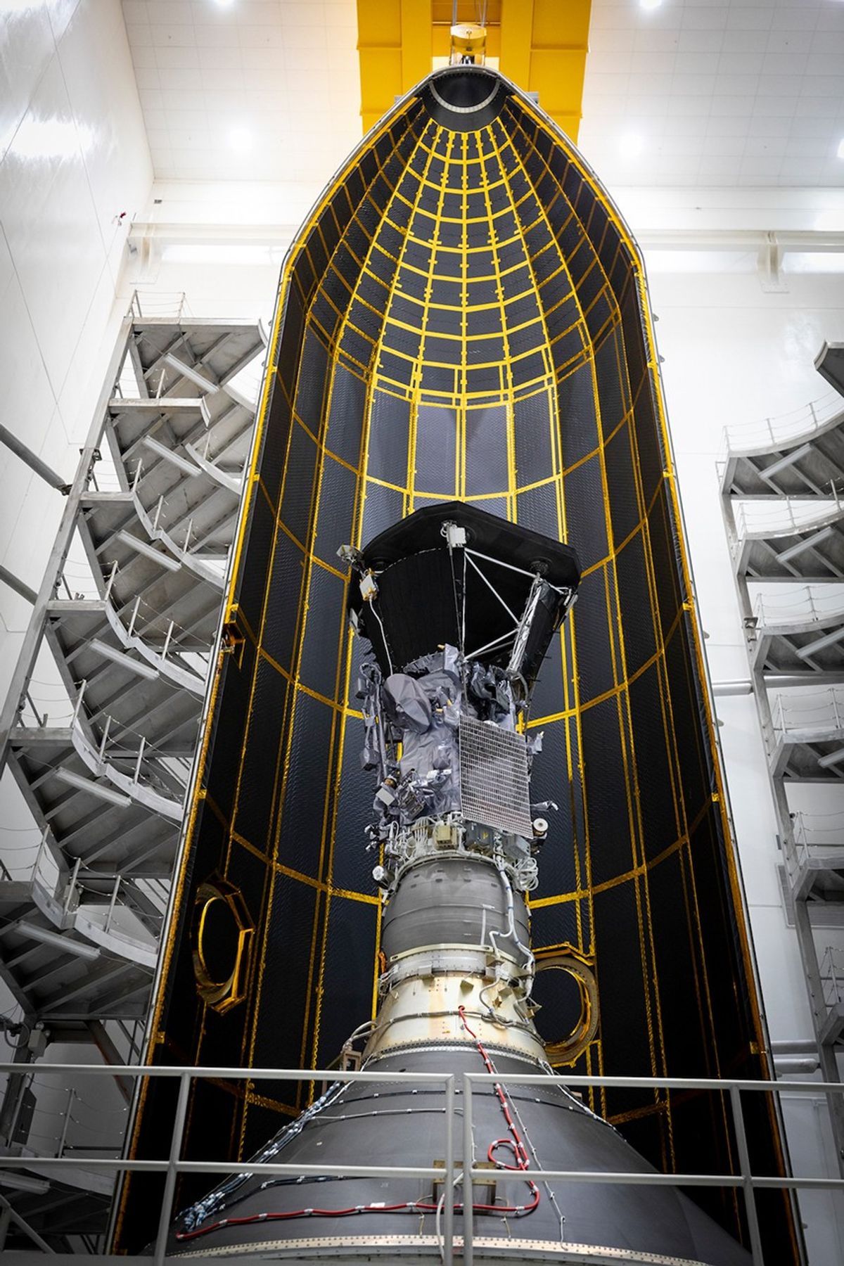 spacecraft inside vertical rocket fairing