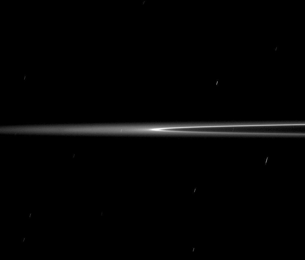 The bright arc of material in Saturn's G ring is seen here as it rounds the ring's edge, or ansa.