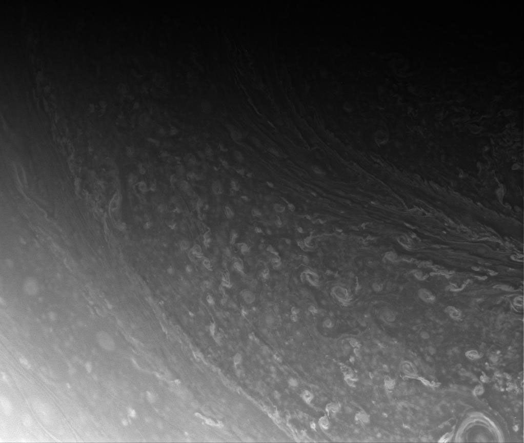 Storms in the blustery cloud bands of Saturn's high north