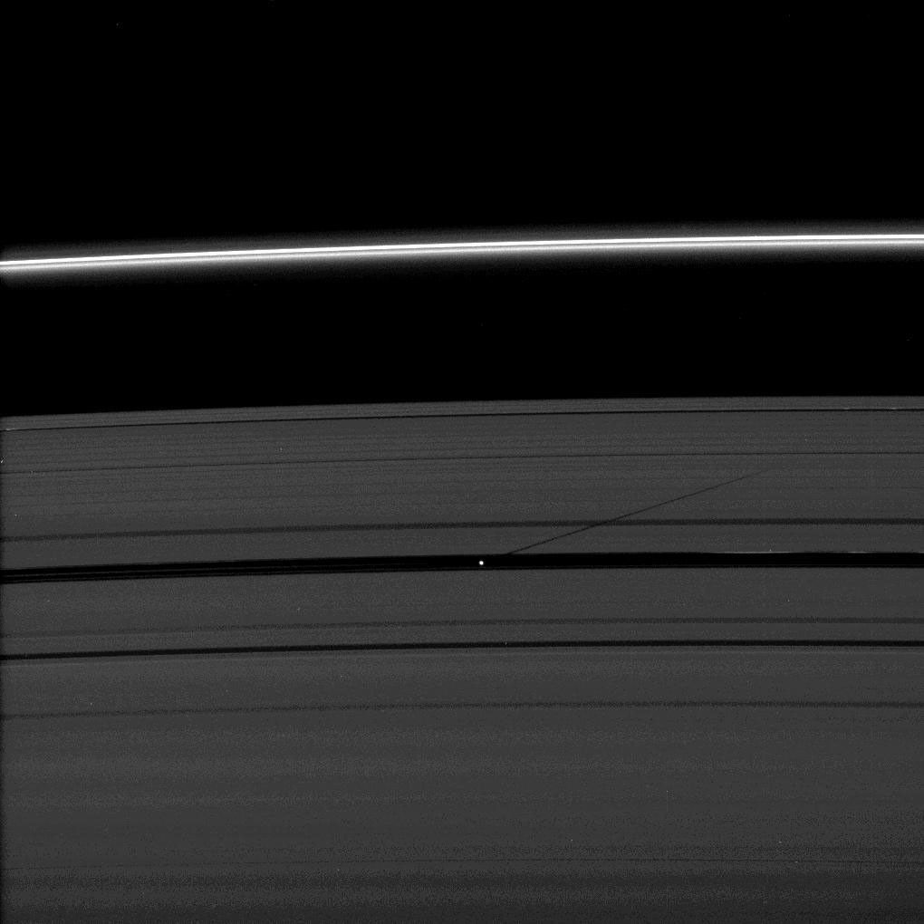 The moon Pan casts a shadow on Saturn's outer A ring in this image taken as the planet approached its August 2009 equinox.