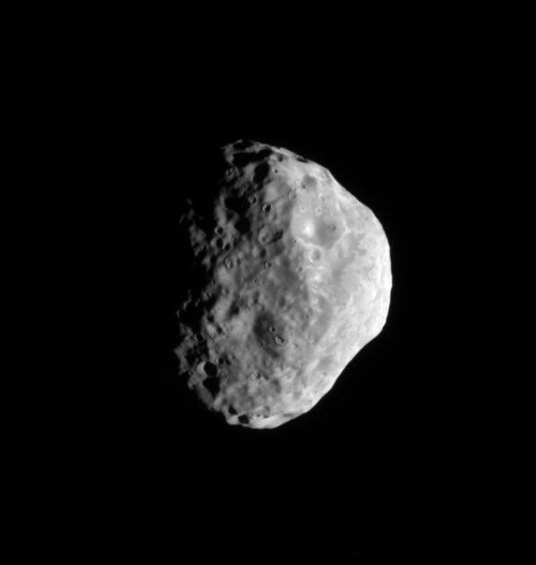 The Cassini spacecraft looks toward the south pole and cratered surface of Saturn's moon Janus.