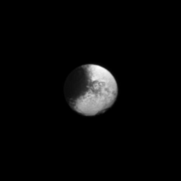 A large dark region fills a semicircle of the visible disk of Iapetus on the left of this Cassini spacecraft image.