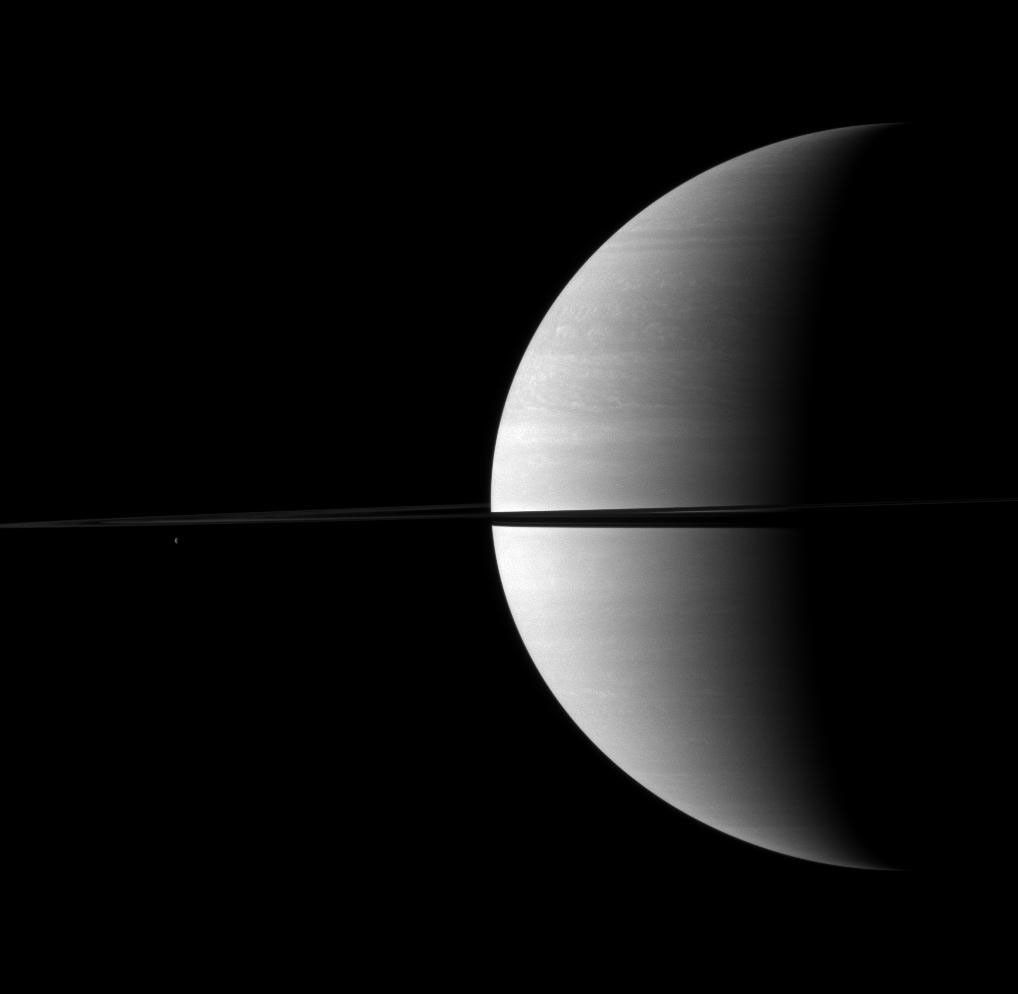The rings split the planet in two in this Cassini spacecraft view of a crescent Saturn.