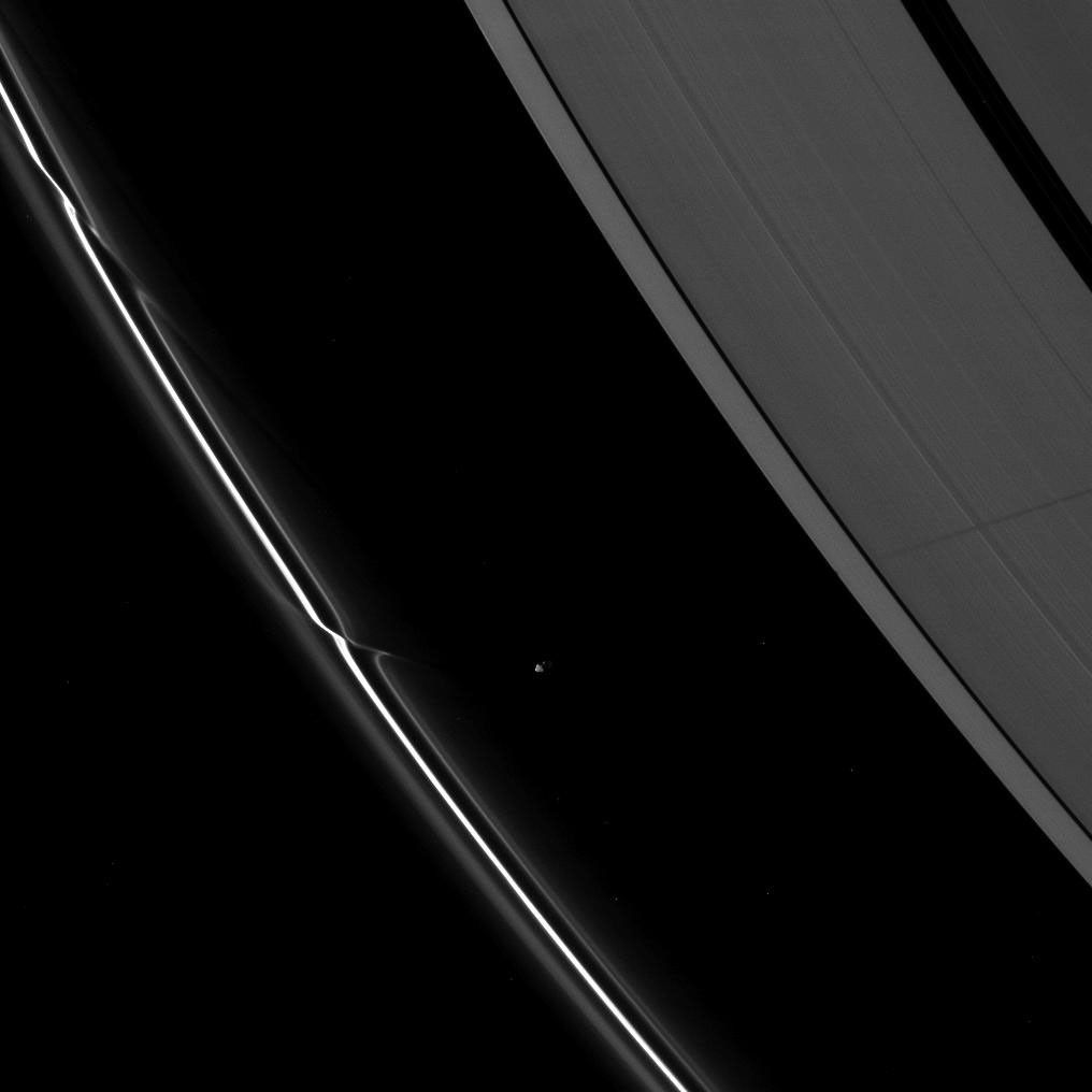 Saturn's moon Prometheus casts a long shadow across the A ring in the middle-right side of this Cassini spacecraft image taken shortly before the planet's August 2009 equinox.