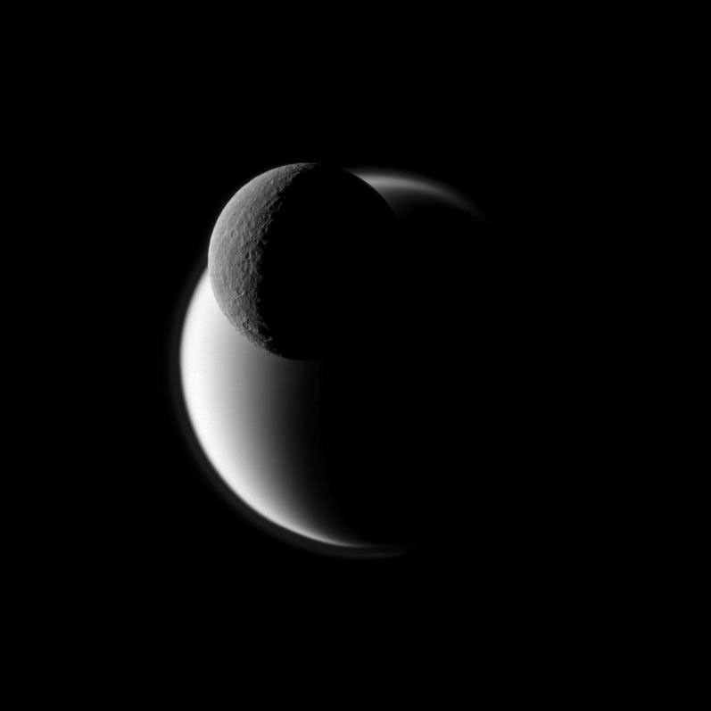 Rhea, top, and Titan