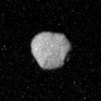 Voyager 2 took this image of Neptune's irregularly-shaped satellite 1989N1 from a range of 870,000 kilometers (540,000 miles).