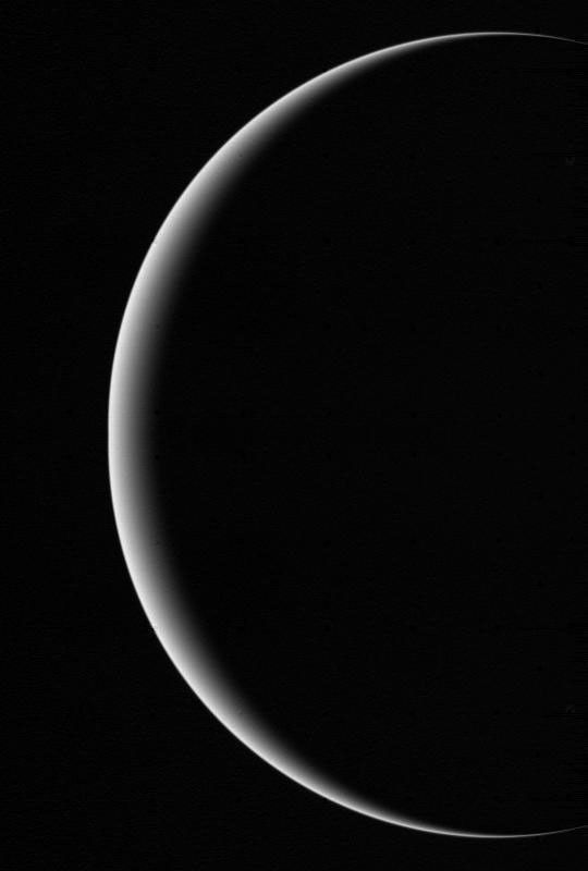 This image shows a crescent Uranus, a view that Earthlings never witnessed until Voyager 2 flew near and then beyond Uranus on January 24, 1986.