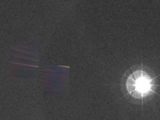 This color image of the Sun, Earth and Venus was taken by the Voyager 1 spacecraft Feb. 14, 1990. The planets appear as scattered rays.