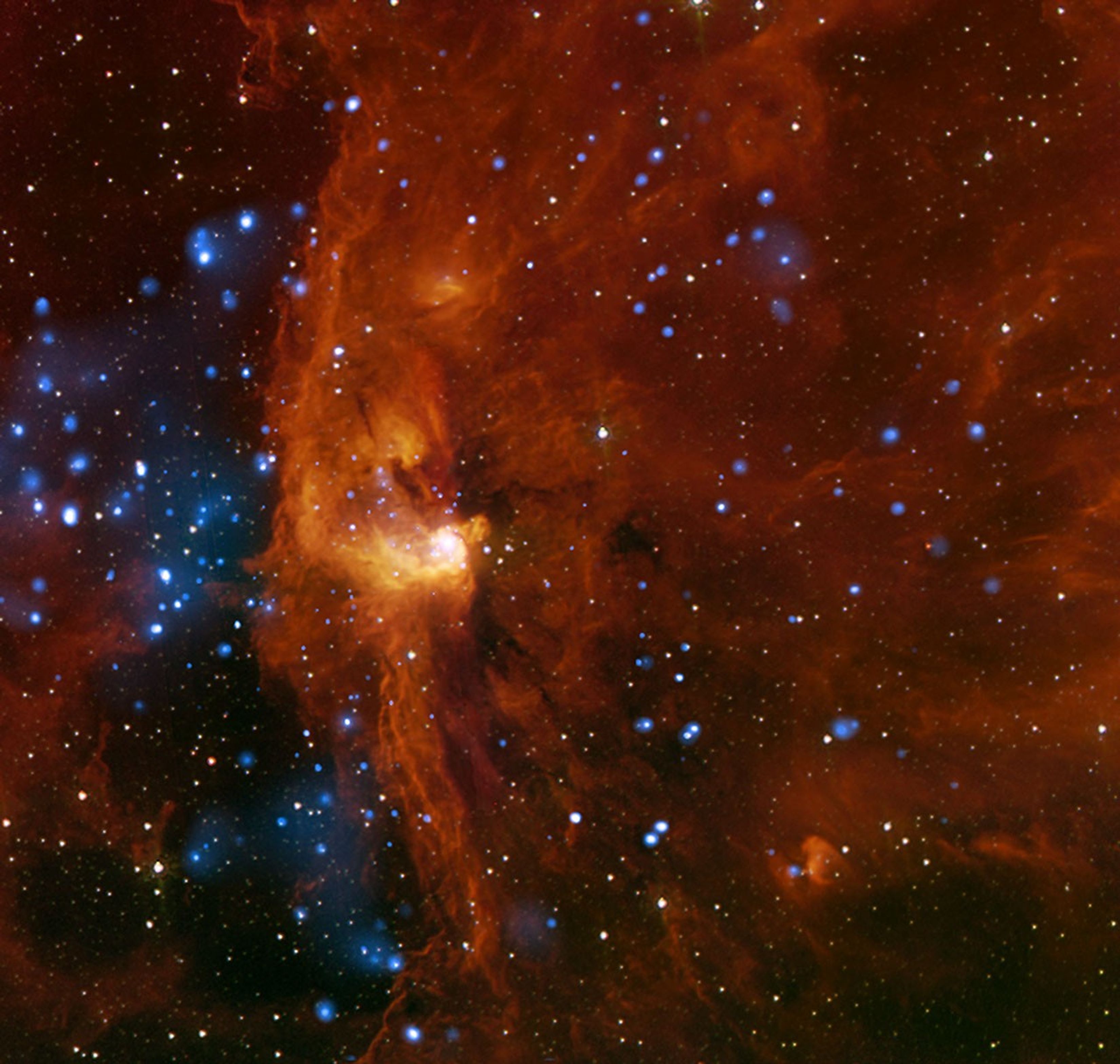 Color photo of star cluster embedded in a cloud of molecular hydrogen