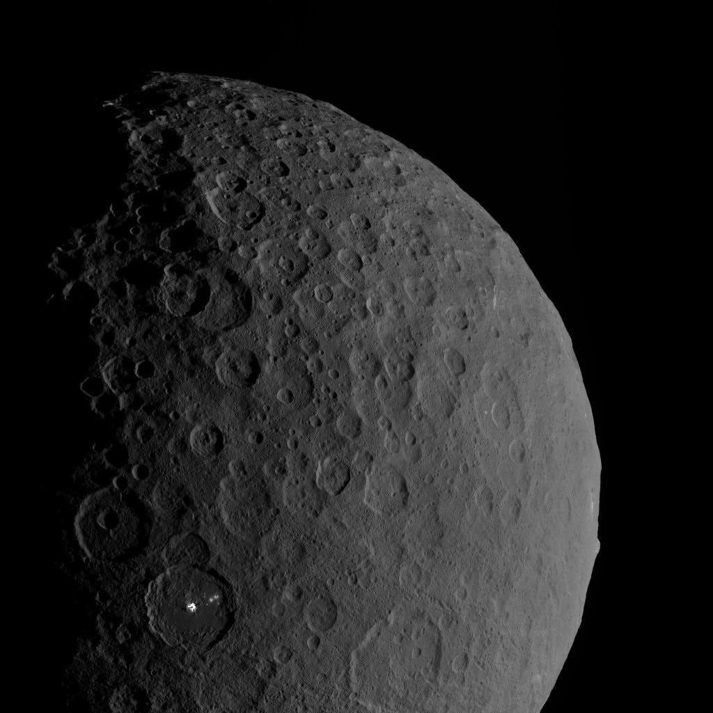 Occator Crater and Ahuna Mons appear together in this view obtained by NASA's Dawn spacecraft on February 11, 2017.