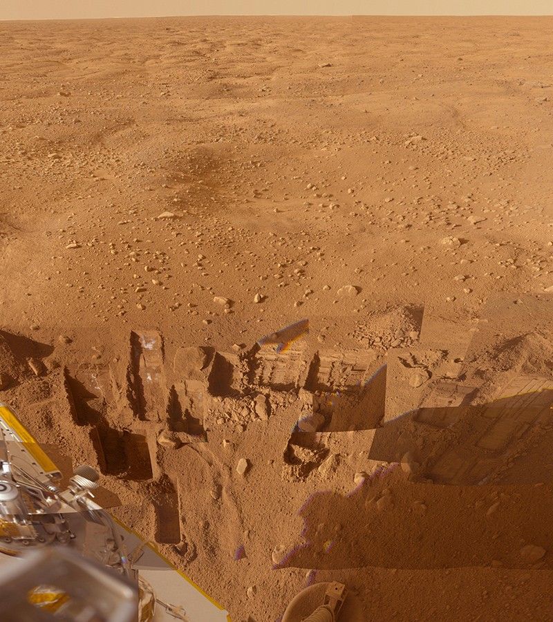 This mosaic of images from the Surface Stereo Imager camera on NASA's Phoenix Mars Lander shows several trenches dug by Phoenix, plus a corner of the spacecraft's deck and the Martian arctic plain stretching to the horizon.