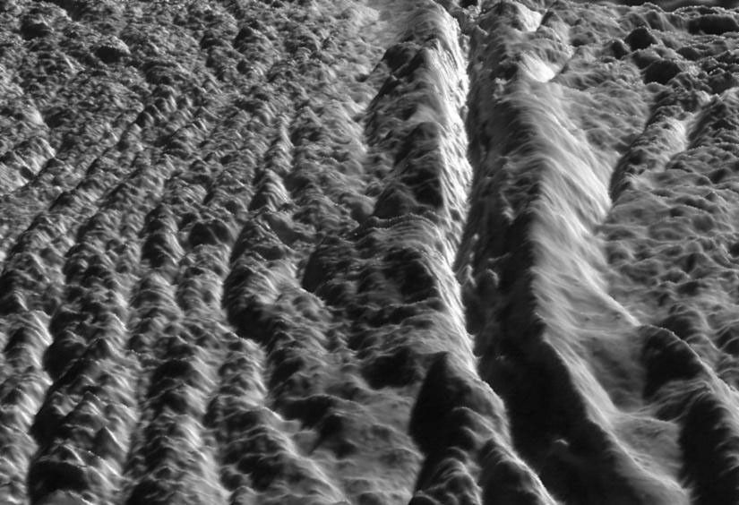 This perspective view of Damascus Sulcus was generated using high resolution images of Enceladus acquired in August 2008 at 12 to 30 meters (40 to 100 feet) resolution, together with a new topographic map of the region produced by Dr. Paul Schenk at the Lunar and Planetary Institute in Houston, TX.