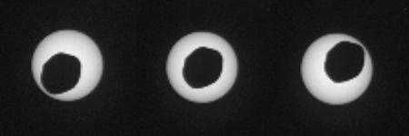 This set of three images shows views three seconds apart as the larger of Mars' two moons, Phobos, passed directly in front of the sun as seen by NASA's Mars rover Curiosity.