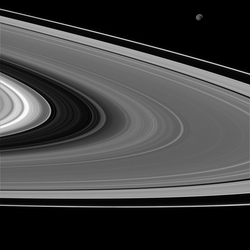 Saturn's rings and Mimas (upper right) lit by light reflected off of Saturn.