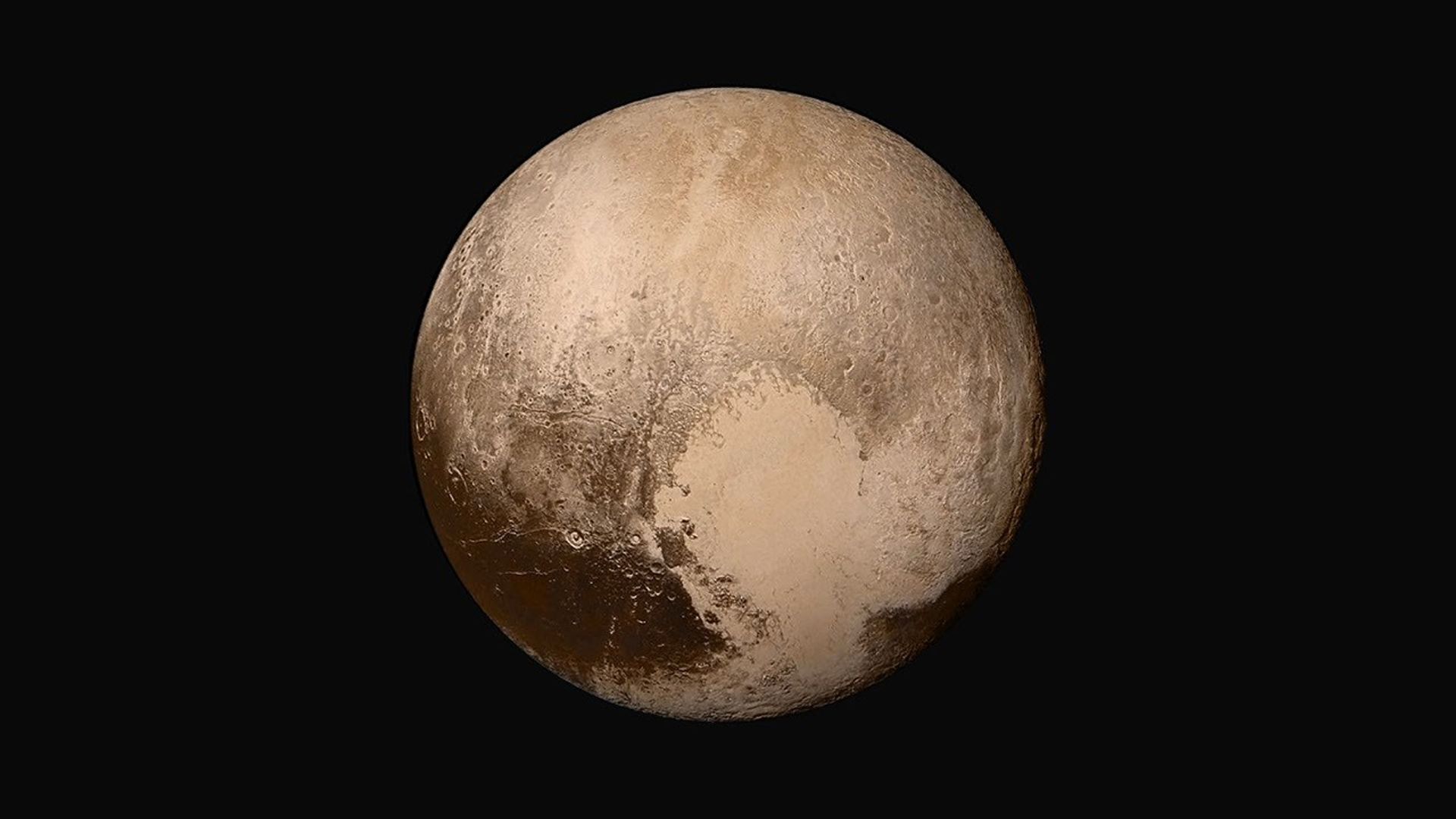 Four images from NASA's New Horizons' Long Range Reconnaissance Imager (LORRI) were combined with color data from the Ralph instrument to create this global view of Pluto.