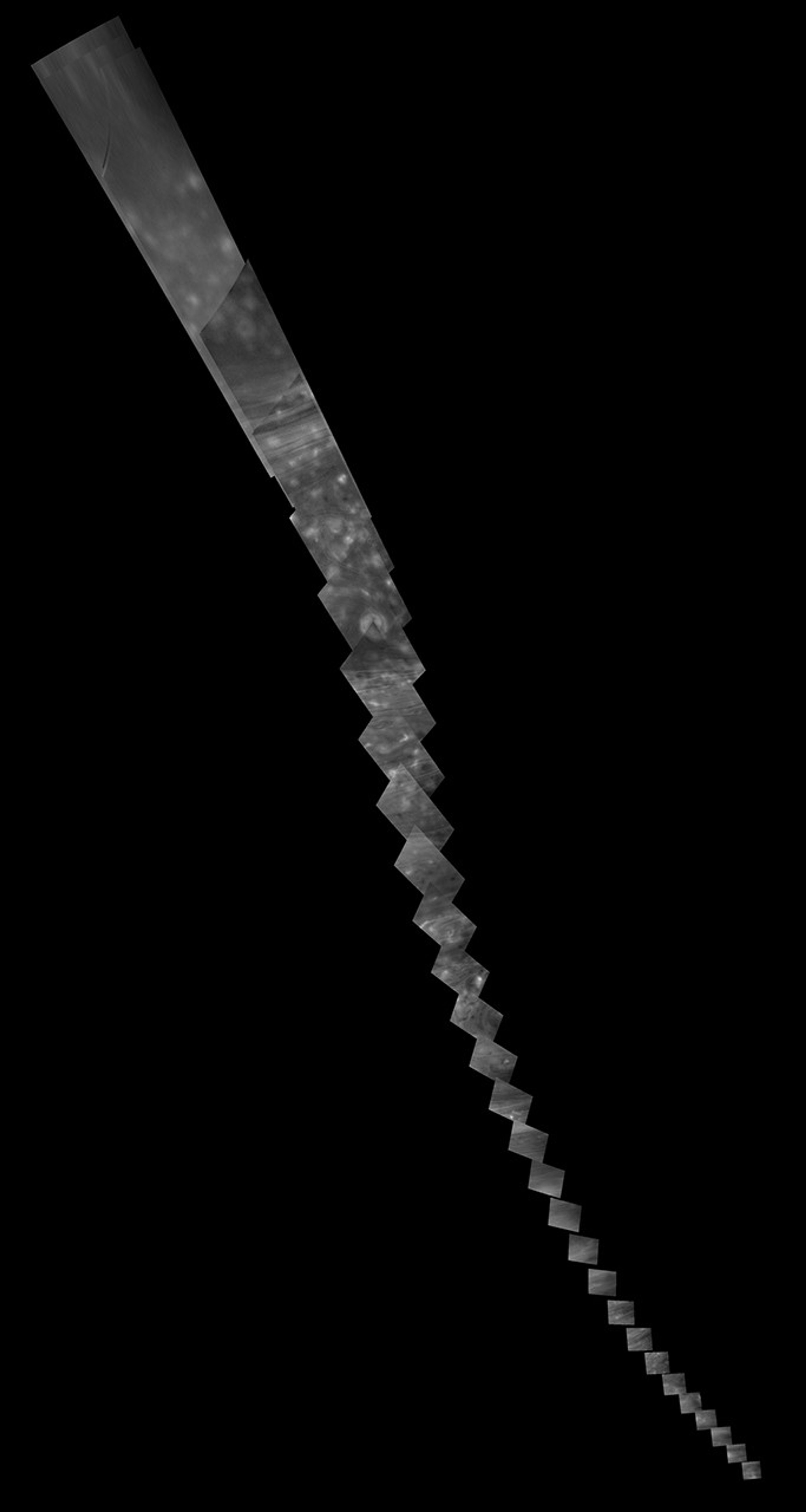 Black and white image showing a swath of Saturn's atmosphere.