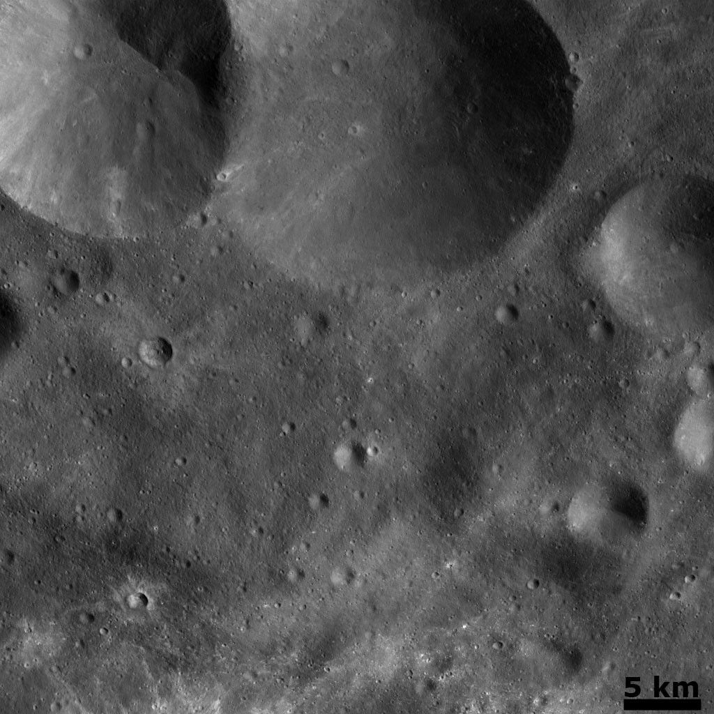 Vesta's Cratered Landscape: Double Crater and Craters with Bright Ejecta
