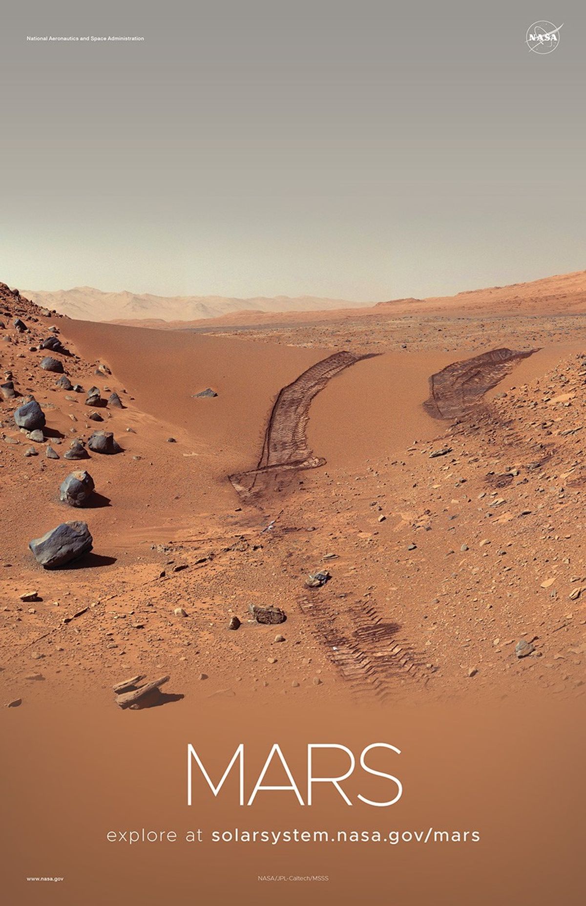 Rover tracks in sand on Mars.