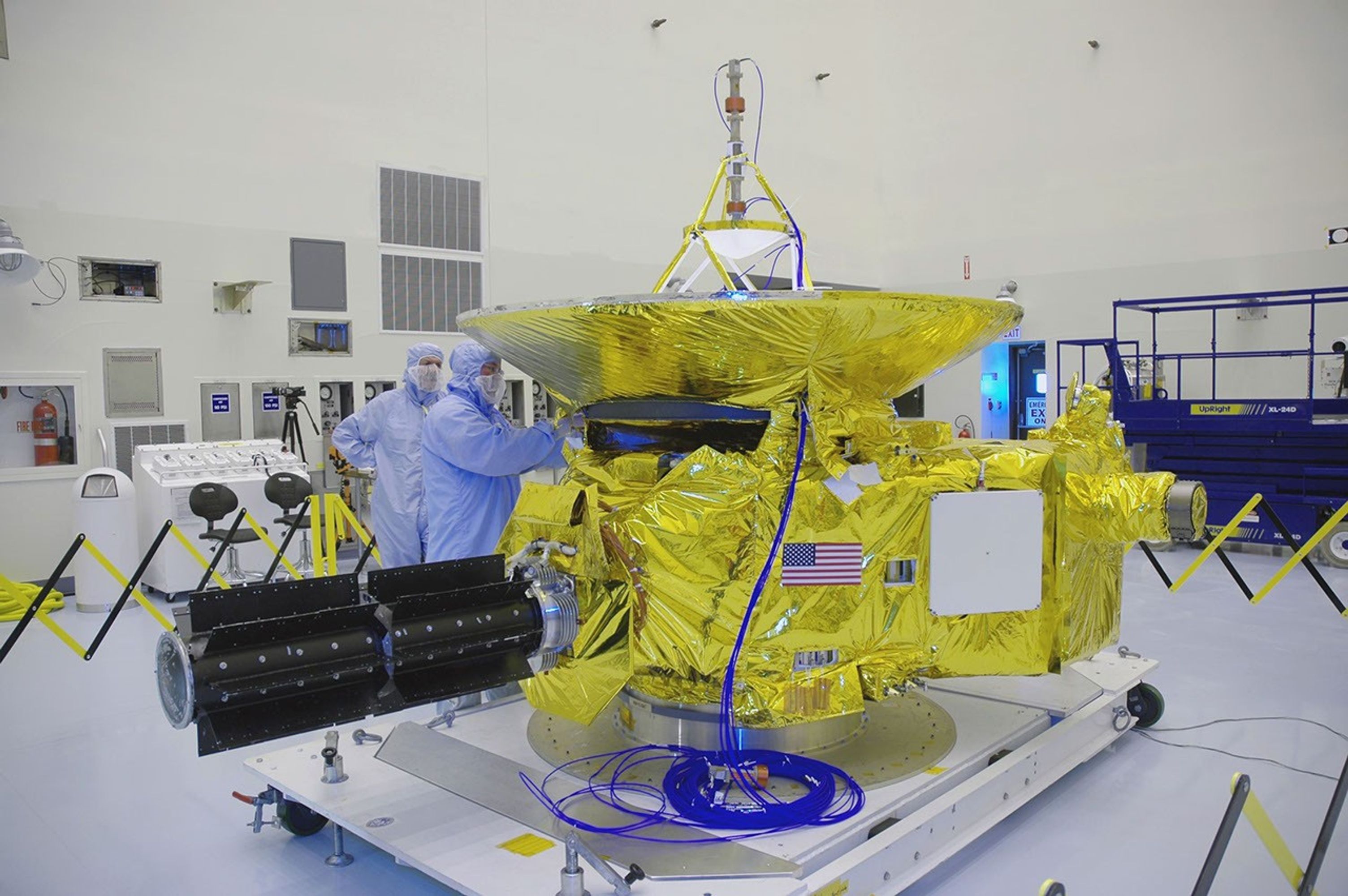 u.s. flag visible on spacecraft in clean room