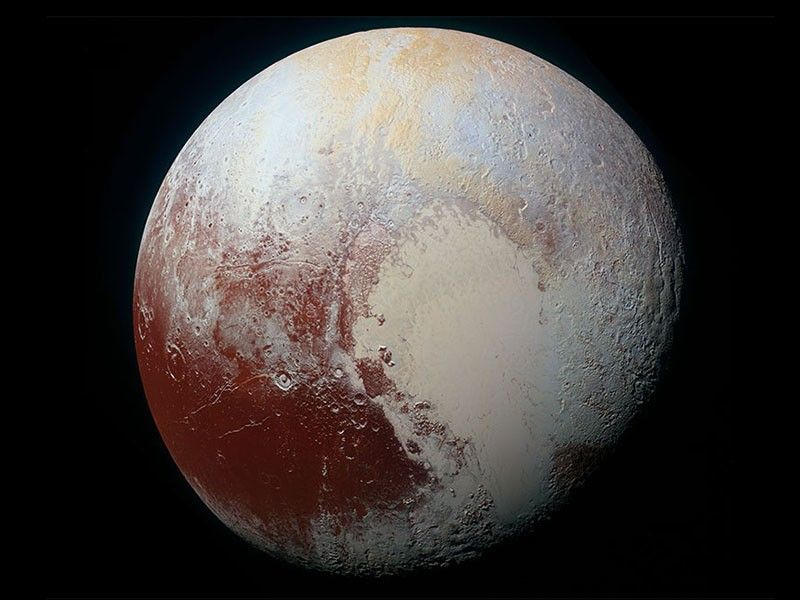 Color enhanced image of Pluto that shows a heart shape.