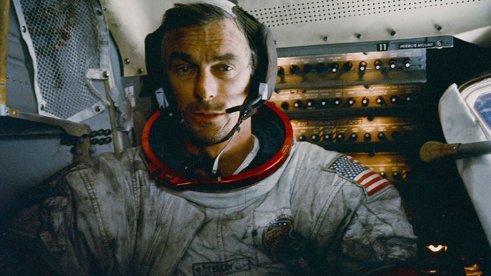 Dusty astronaut in Apollo spacecraft.