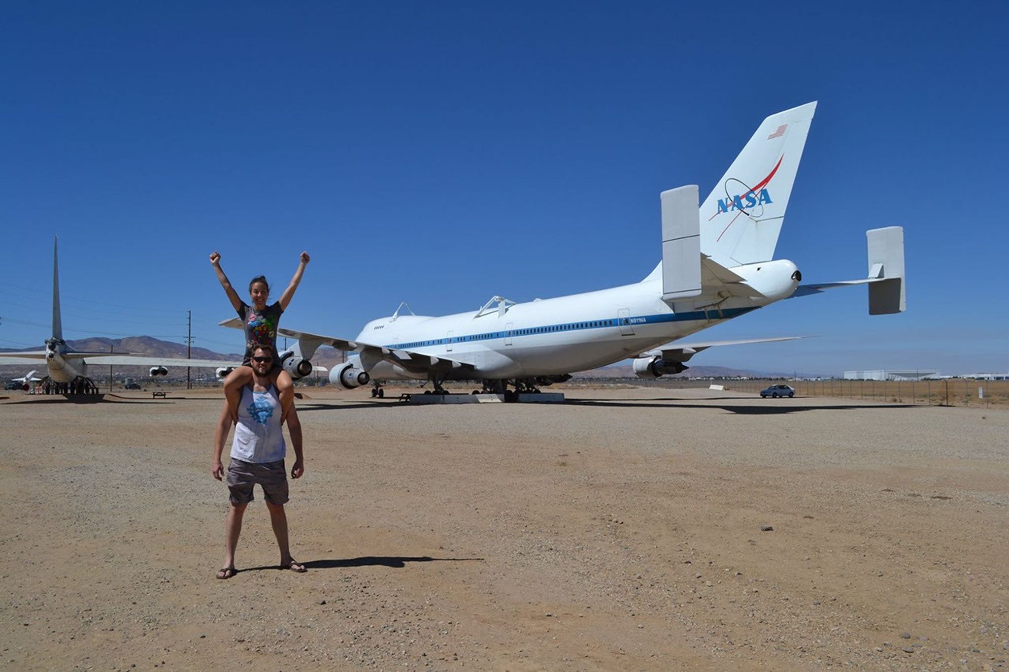 In front of a NASA shuttle carrier