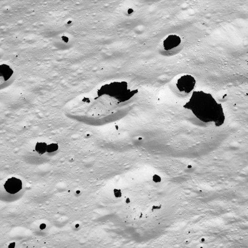 Inky Stains on a Frozen Moon