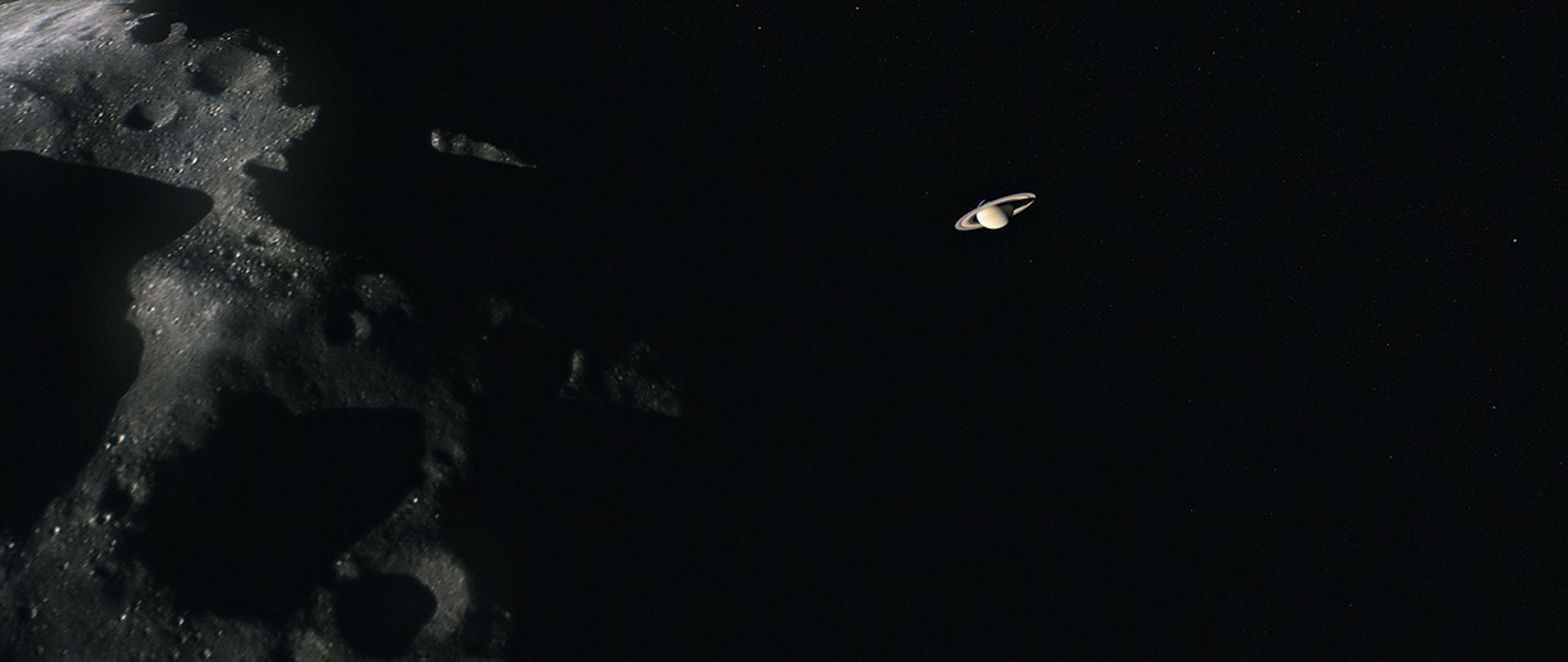 Illustration of Phoebe with Saturn in the distance.