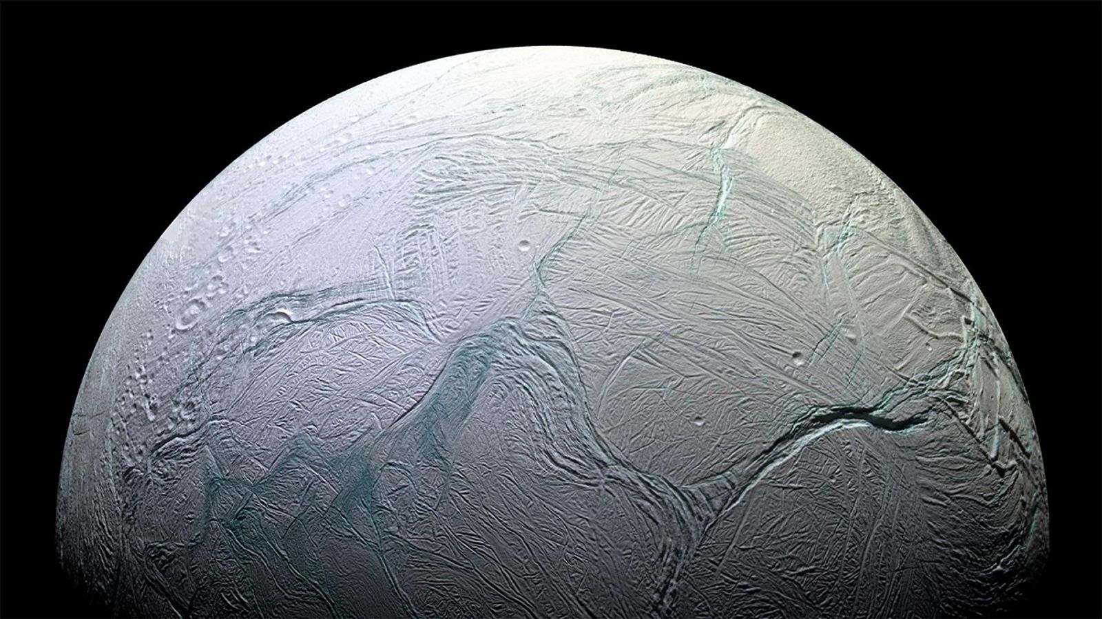 Enceladus with dramatic water vapor plume - NASA/JPL
