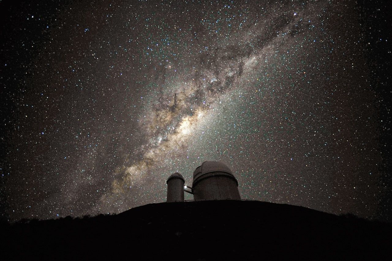 Milky Way Galaxy above telescope.