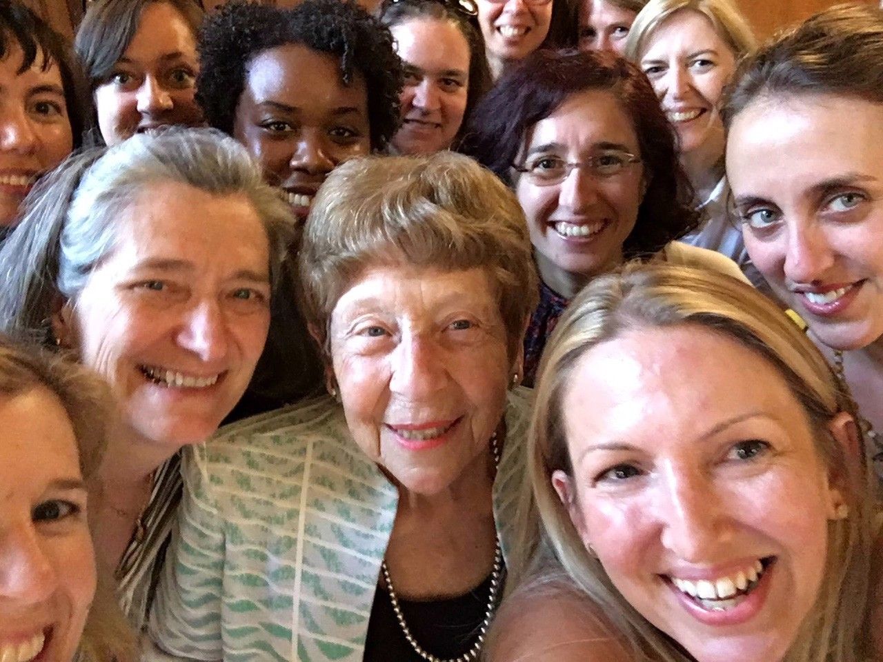 Marget Kivelson surrounded by women colleagues.
