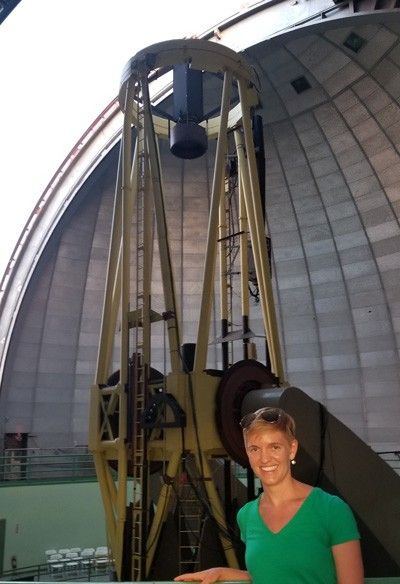Courtney Dressing with telescope in background