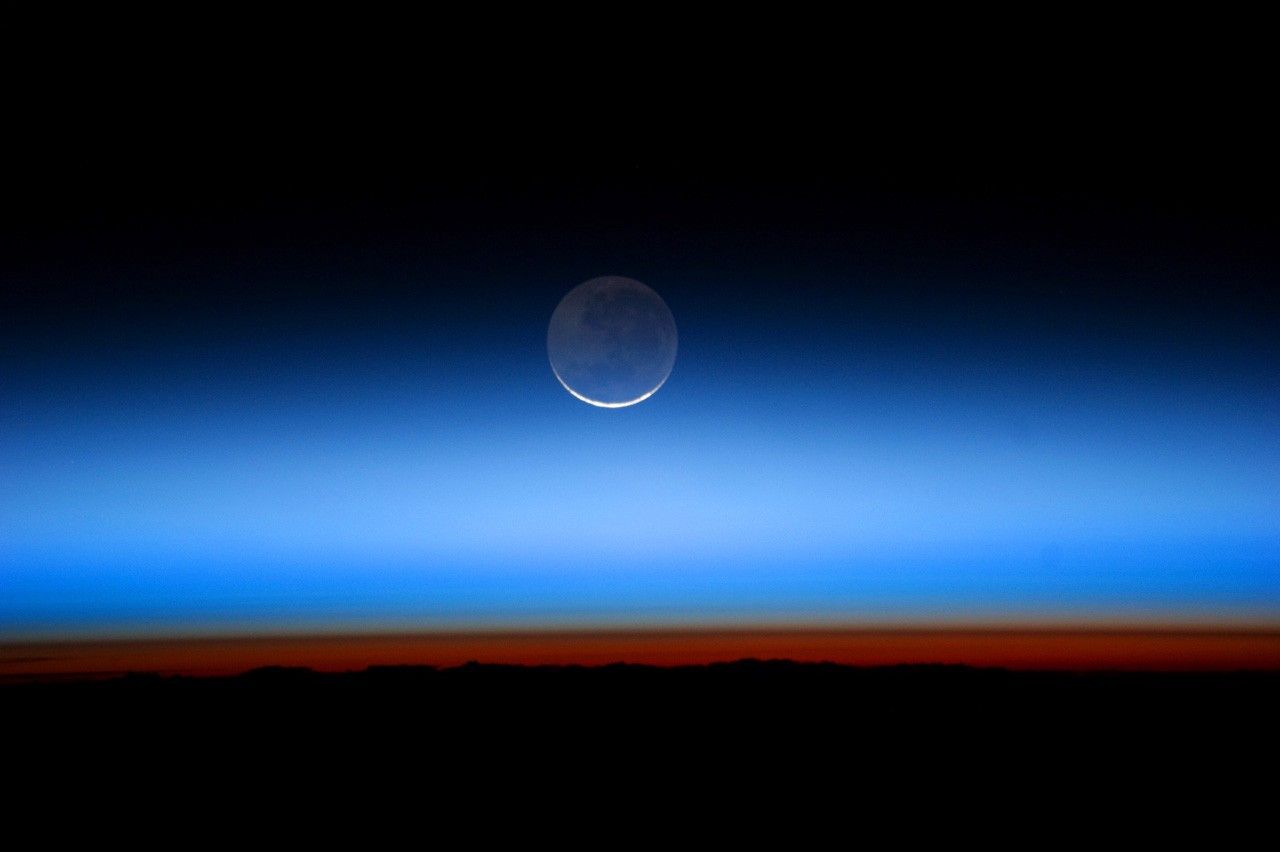 The Moon above Earth from orbit.