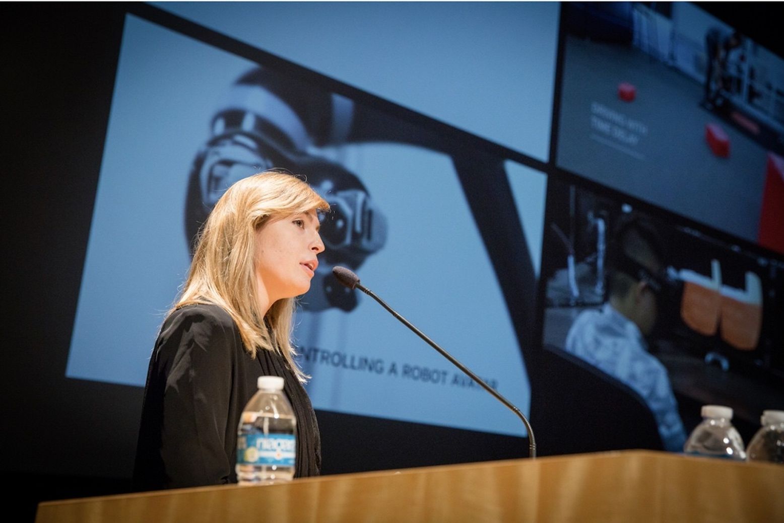 woman speaking at lectern