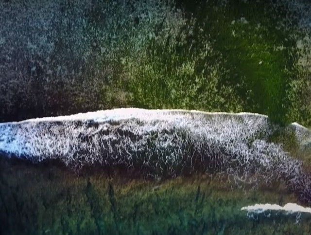 overhead shot of waves crashing