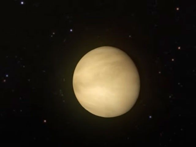 A yellow orb floats in a black sky.