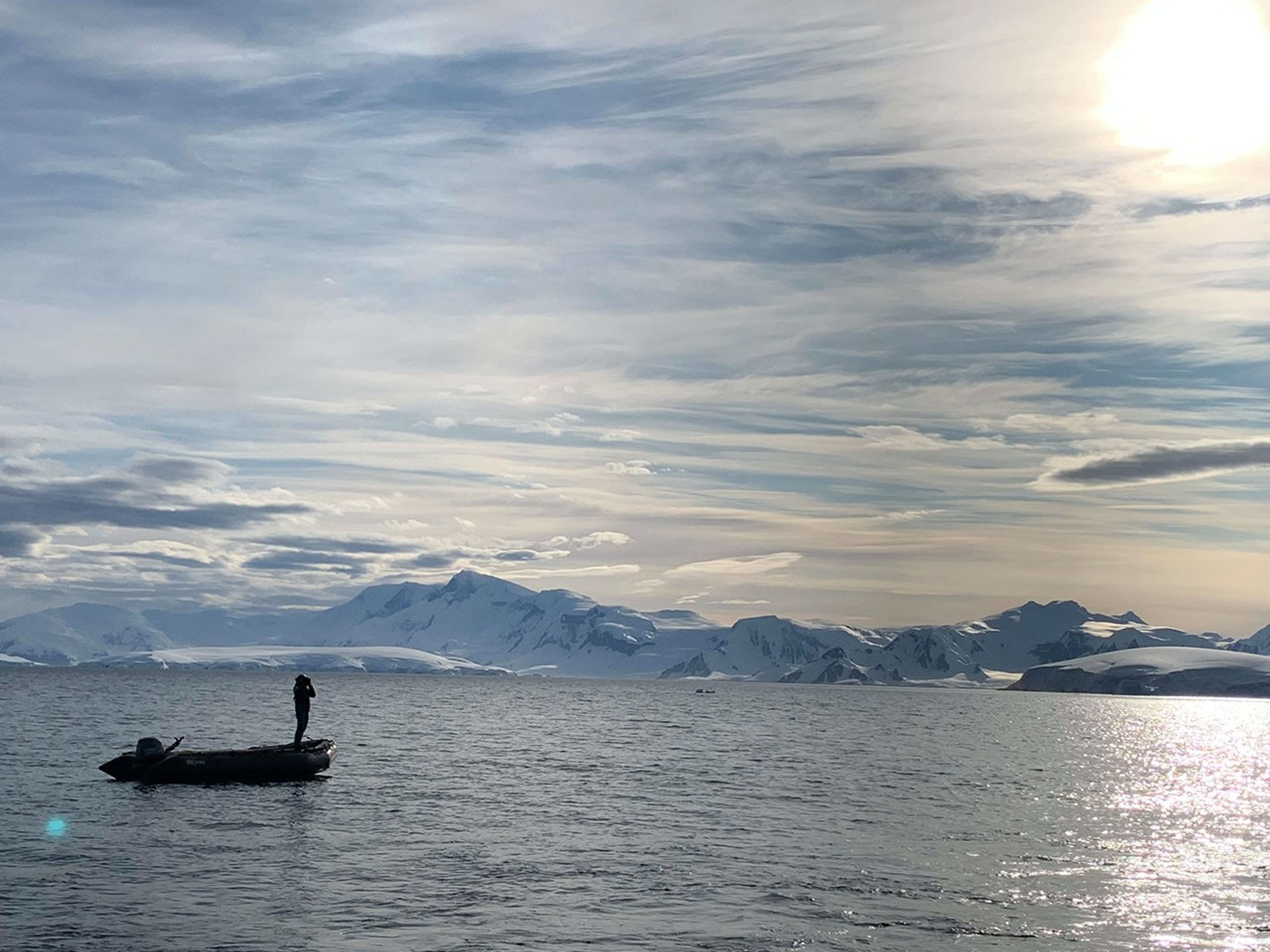 Annette spotting whales on the Antarctic Peninsula.